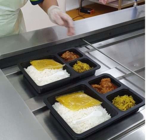 Before bento boxes have been sealed by sealing machine from UK